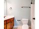 Bathroom featuring single sink, toilet, and shower with bronze fixtures at 704 E Catawba St, Belmont, NC 28012