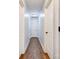 Hallway with wood flooring and white doors at 704 E Catawba St, Belmont, NC 28012