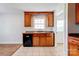 The kitchen features wood cabinets and modern appliances at 704 E Catawba St, Belmont, NC 28012
