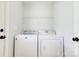 Bright laundry room with washer and dryer at 704 E Catawba St, Belmont, NC 28012
