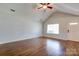 Bright living room featuring hardwood floors, ceiling fan and natural light at 704 E Catawba St, Belmont, NC 28012