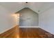 Bright living room features hardwood floors, neutral paint, and an arched ceiling at 704 E Catawba St, Belmont, NC 28012