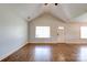 Vaulted living room featuring hardwood floors and window at 704 E Catawba St, Belmont, NC 28012