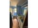 Retro bathroom with blue walls, dual sinks, and linoleum flooring at 785 Nc Highway 109 N Hwy, Troy, NC 27371