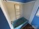 Vintage blue bathtub and shower with built in shelving, set against neutral wall and a tiled border at 785 Nc Highway 109 N Hwy, Troy, NC 27371