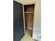 Empty closet with linoleum floor with one shelf, and white wall paneling at 785 Nc Highway 109 N Hwy, Troy, NC 27371