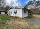Shot of an older white sided home with a brick foundation and a dark shutter at 785 Nc Highway 109 N Hwy, Troy, NC 27371