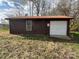 A stand alone, brown garage, with a white garage door and window at 785 Nc Highway 109 N Hwy, Troy, NC 27371