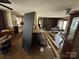 An incomplete kitchen space with laminate countertops and white cabinets, needing renovation at 785 Nc Highway 109 N Hwy, Troy, NC 27371