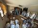 Bright living room featuring a brick fireplace and is undergoing renovation, with paint and materials staged throughout at 785 Nc Highway 109 N Hwy, Troy, NC 27371