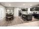 Modern eat-in kitchen with stainless steel appliances, an island, and wood flooring throughout at 00123 Millstream Dr, China Grove, NC 28023