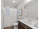Clean bathroom with a shower featuring white curtain, a single vanity, and modern fixtures for everyday convenience at 1062 River Haven Sw Ave, Concord, NC 28025