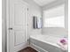 Relaxing bathroom featuring a soaking tub, a window for natural light, and modern fixtures for comfort at 1062 River Haven Sw Ave, Concord, NC 28025