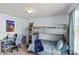 Fun bedroom with bunk beds, a desk area, and playful decor creating a comfortable and vibrant space at 1062 River Haven Sw Ave, Concord, NC 28025