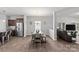Open dining area with a modern table, stainless steel appliances, and seamless connection to the living room at 1062 River Haven Sw Ave, Concord, NC 28025