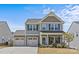 Charming two-story home featuring a two-car garage, landscaped yard, and inviting curb appeal at 1062 River Haven Sw Ave, Concord, NC 28025