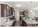A stylish kitchen featuring granite countertops, stainless steel appliances, and a functional center island at 1062 River Haven Sw Ave, Concord, NC 28025