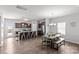 Modern kitchen with stainless steel appliances, a breakfast bar, and a dining area, perfect for cooking and entertaining at 1062 River Haven Sw Ave, Concord, NC 28025