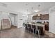 Well-appointed kitchen featuring a large island and stainless steel appliances, seamlessly connecting to the staircase at 1062 River Haven Sw Ave, Concord, NC 28025