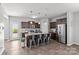 A spacious kitchen with stainless steel appliances, a large island, and sleek wood floors at 1062 River Haven Sw Ave, Concord, NC 28025
