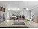 A view from the kitchen island showcases open-concept living with a dining area and living space beyond at 1062 River Haven Sw Ave, Concord, NC 28025