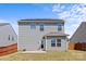 Rear exterior of two-story home featuring solar panels and vinyl siding at 1062 River Haven Sw Ave, Concord, NC 28025