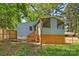 Lovely view of the backyard featuring a screened-in porch and wooden deck overlooking the lush green space at 1104 Norris Ave, Charlotte, NC 28206