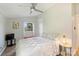 Bright bedroom features a ceiling fan, natural light and views of the outdoors at 1104 Norris Ave, Charlotte, NC 28206
