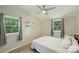 Light bedroom with multiple windows and natural light with hardwood floors and a queen bed at 1104 Norris Ave, Charlotte, NC 28206