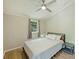 Bright bedroom with a full bed, side table, and hardwood floors and lots of natural light at 1104 Norris Ave, Charlotte, NC 28206