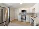 Modern kitchen with stainless appliances, a gas range, and sleek white cabinetry at 1104 Norris Ave, Charlotte, NC 28206