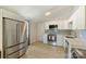 Spacious kitchen featuring stainless steel appliances, light countertops, and wood look floors at 1104 Norris Ave, Charlotte, NC 28206