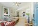 Bright living room with modern fan, sectional couch, hardwood floors, and connecting kitchen at 1104 Norris Ave, Charlotte, NC 28206