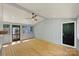 Enclosed sunroom has hardwood floors, a ceiling fan and lots of windows at 1104 Norris Ave, Charlotte, NC 28206