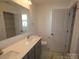 Well-lit bathroom featuring double sinks with a neutral vanity at 1119 Overbrook Pl, Wingate, NC 28174