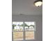 Bright daytime view from a home's double window overlooking newly constructed homes at 1119 Overbrook Pl, Wingate, NC 28174