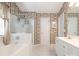 Well-lit bathroom with a soaking tub, a stand-up shower, and white cabinets at 113 Rocky Trail Ct, Fort Mill, SC 29715