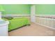 This bedroom showcases bright green walls and a unique floral wallpaper border, adding a distinctive design element at 113 Rocky Trail Ct, Fort Mill, SC 29715