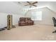 A spacious bonus room with a plush leather sofa and fitness equipment, offering a versatile living area at 113 Rocky Trail Ct, Fort Mill, SC 29715