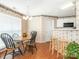 Inviting dining area with wood floors, a round table, and a view to the kitchen at 113 Rocky Trail Ct, Fort Mill, SC 29715