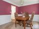 Cozy dining room with wainscoting details, perfect for Gathering meals and entertaining at 113 Rocky Trail Ct, Fort Mill, SC 29715