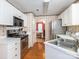 Charming kitchen with white cabinetry, stainless steel appliances, and a view into the dining room at 113 Rocky Trail Ct, Fort Mill, SC 29715