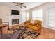 The living room includes a fireplace, wood floors, and direct access to the backyard at 113 Rocky Trail Ct, Fort Mill, SC 29715