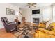 Cozy living room features a fireplace, wood floors and lots of natural light at 113 Rocky Trail Ct, Fort Mill, SC 29715