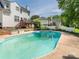Wide shot of inviting pool with a diving board and backyard landscape at 113 Rocky Trail Ct, Fort Mill, SC 29715