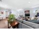 Finished basement featuring a large sectional sofa, accent chairs and neutral carpet at 1209 Yale Pl, Charlotte, NC 28209