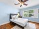 Bedroom with hardwood floors, ceiling fan, large windows and white trim at 1209 Yale Pl, Charlotte, NC 28209