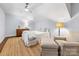 Bright bedroom featuring plantation shutters, hardwood floors and neutral decor at 1209 Yale Pl, Charlotte, NC 28209