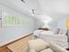 Bright bedroom featuring plantation shutters, hardwood floors and neutral decor at 1209 Yale Pl, Charlotte, NC 28209