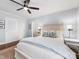 Bright bedroom featuring hardwood floors, neutral tones, ample closet space, and comfortable furnishings at 1209 Yale Pl, Charlotte, NC 28209